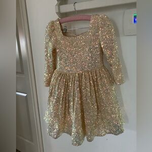 Champagne sequin modeling dress